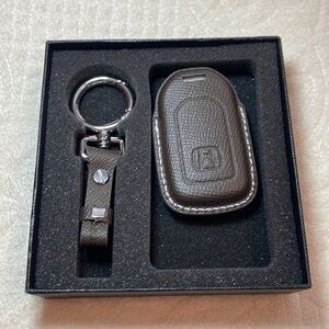 Leather Key fob cover and keychain with Honda branding.